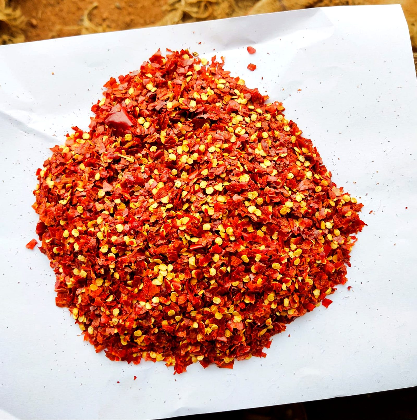 Crushed chilli flakes - cut to your specified flake size Crushed Byadgi red chilli flakes with seeds, cut to export flake size at MKB Enterprises